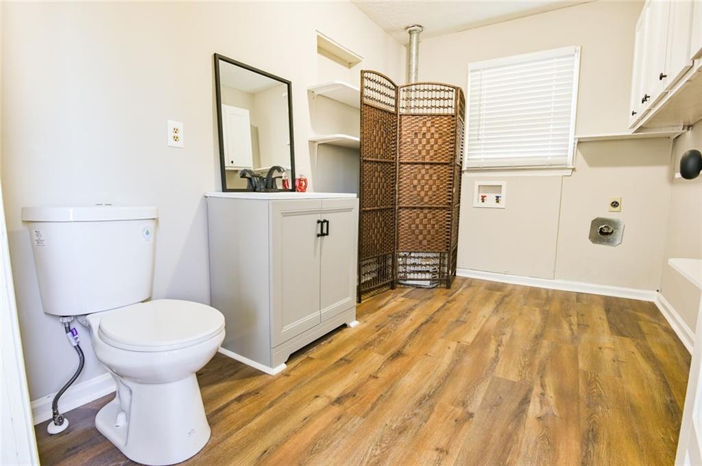 8196 Lakeview Drive Southwest Covington, GA 30014 - Photo 33 of 51 a bathroom with a toilet and a shower