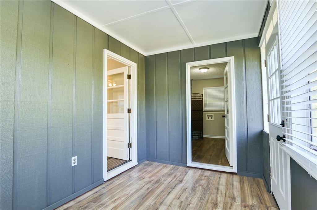 8196 Lakeview Drive Southwest Covington, GA 30014 - Photo 34 of 51 a view of a hallway with wooden floor and closet area