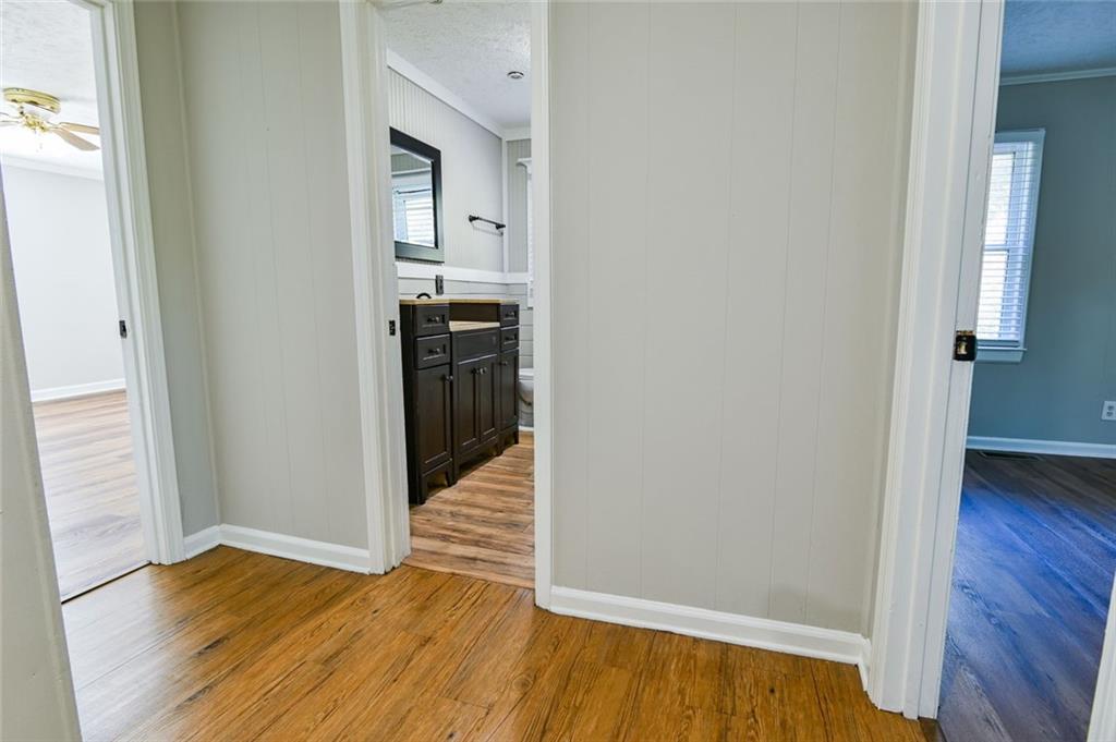 8196 Lakeview Drive Southwest Covington, GA 30014 - Photo 36 of 51 a view of a hallway with wooden floor and staircase