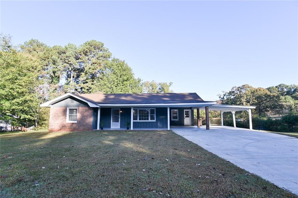 8196 Lakeview Drive Southwest Covington, GA 30014 - Photo 41 of 51 a view of a house with a yard and large tree