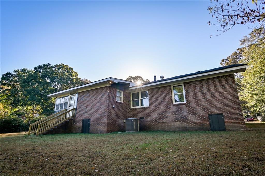 8196 Lakeview Drive Southwest Covington, GA 30014 - Photo 45 of 51 a front view of a house with a garden