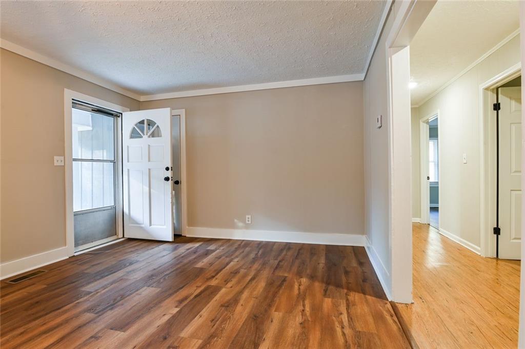 8196 Lakeview Drive Southwest Covington, GA 30014 - Photo 6 of 51 a view of empty room with wooden floor