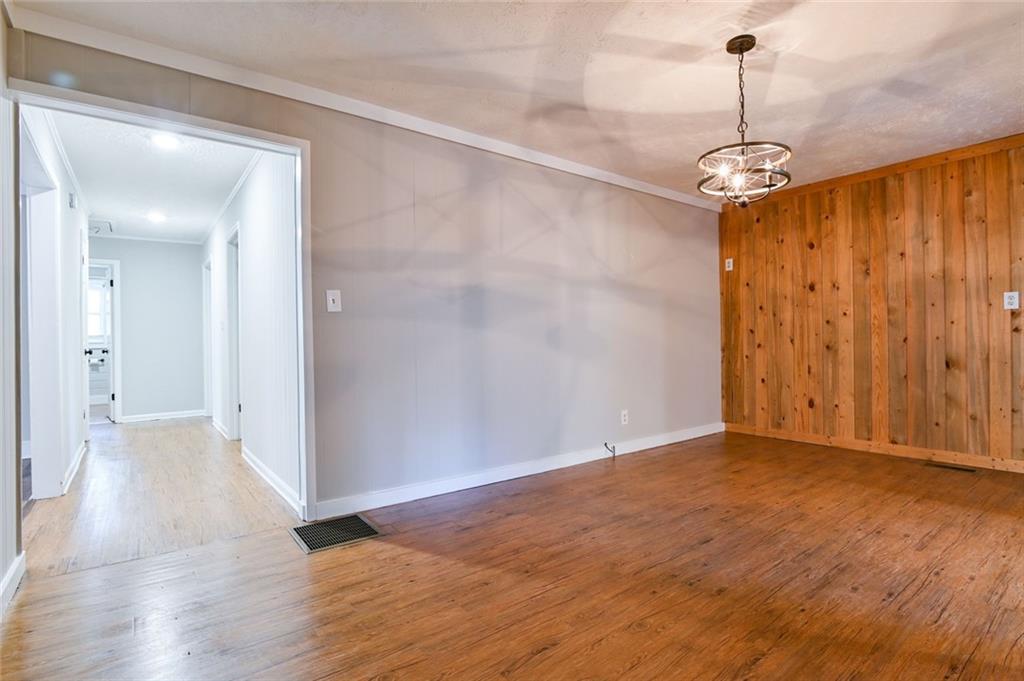 8196 Lakeview Drive Southwest Covington, GA 30014 - Photo 8 of 51 wooden floor in an empty room with a window