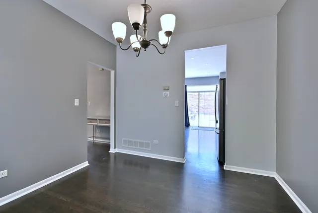 a view of a livingroom with wooden floor