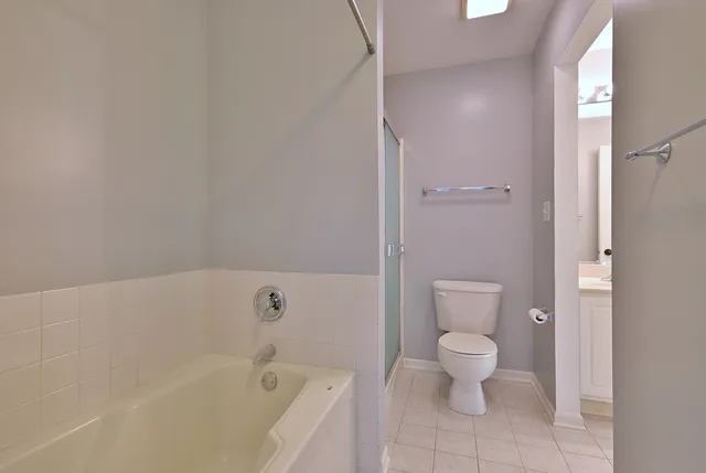 a bathroom with a bathtub and toilet