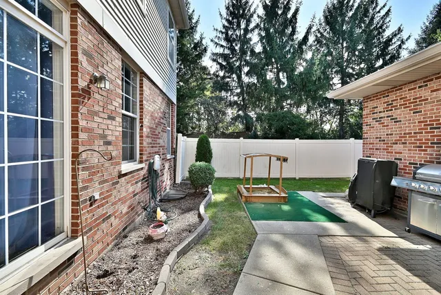 a view of a house with backyard and porch