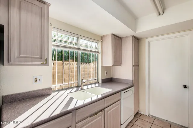 a kitchen with a refrigerator and countertop
