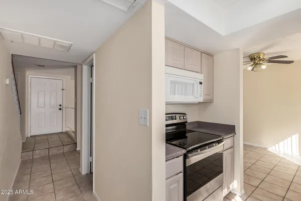 a kitchen with cabinets and appliances