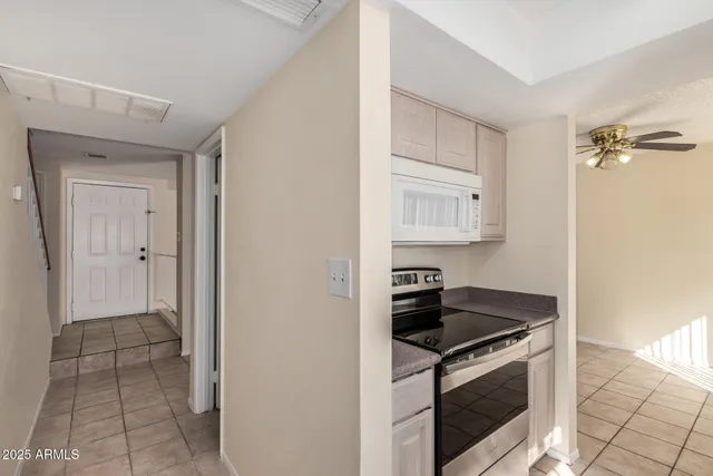 a kitchen with cabinets and appliances