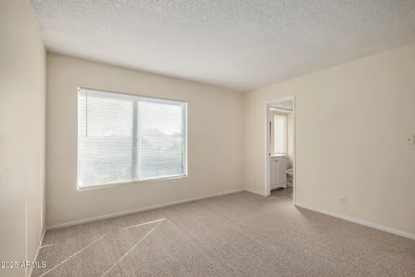 a bathroom with a toilet sink and shower