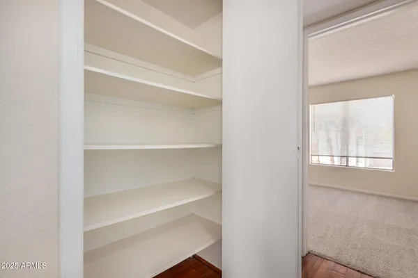 a view of a storage & utility room with washer and dryer