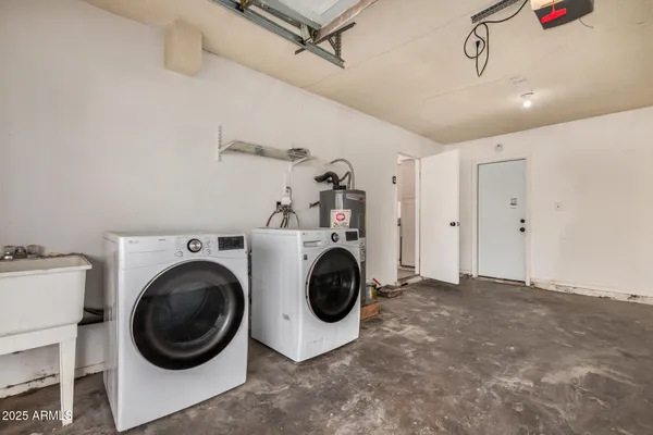 a view of a storage & utility room with washer and dryer