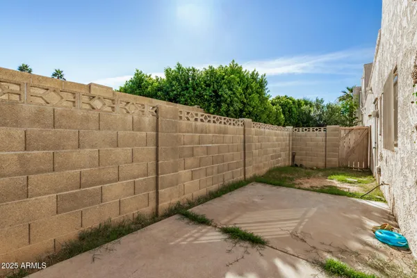 a black and white building with yard