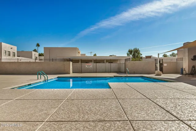 a view of a kitchen with wooden fence