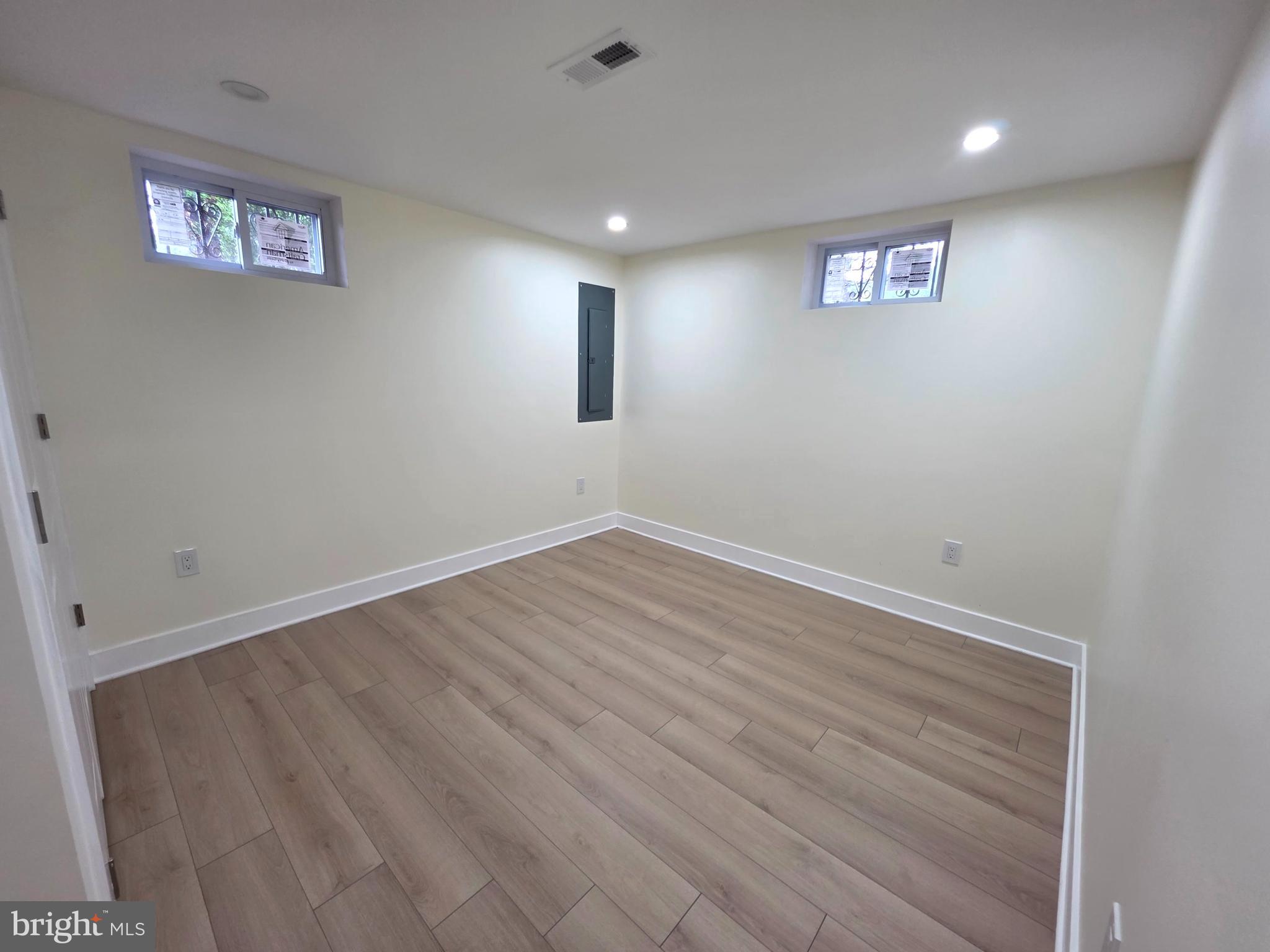 2206 Brinkley Road Fort Washington, MD 20744 - Photo 70 of 78 an empty room with wooden floor and windows