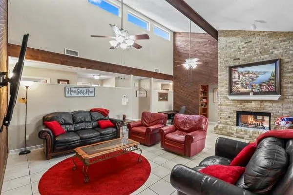 a living room with furniture or couch and a fireplace