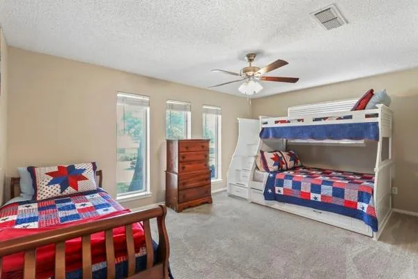 a bedroom with a bed and a tv