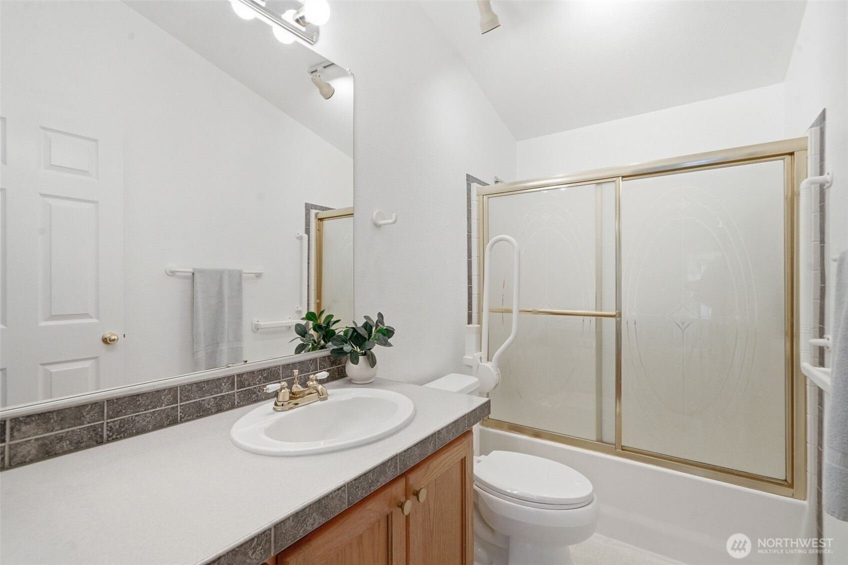 71 East Richardson Road Belfair, WA 98528 - Photo 16 of 31 a bathroom with a sink toilet and shower