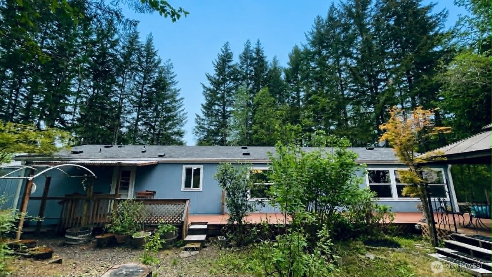 71 East Richardson Road Belfair, WA 98528 - Photo 2 of 31 a view of a house with a yard