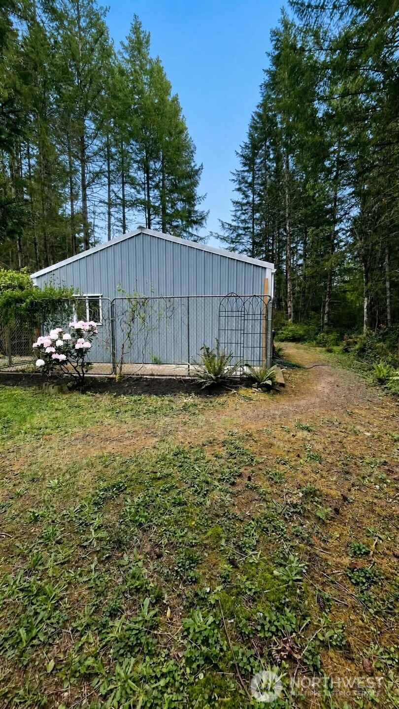 71 East Richardson Road Belfair, WA 98528 - Photo 25 of 31 a view of garden with tall trees