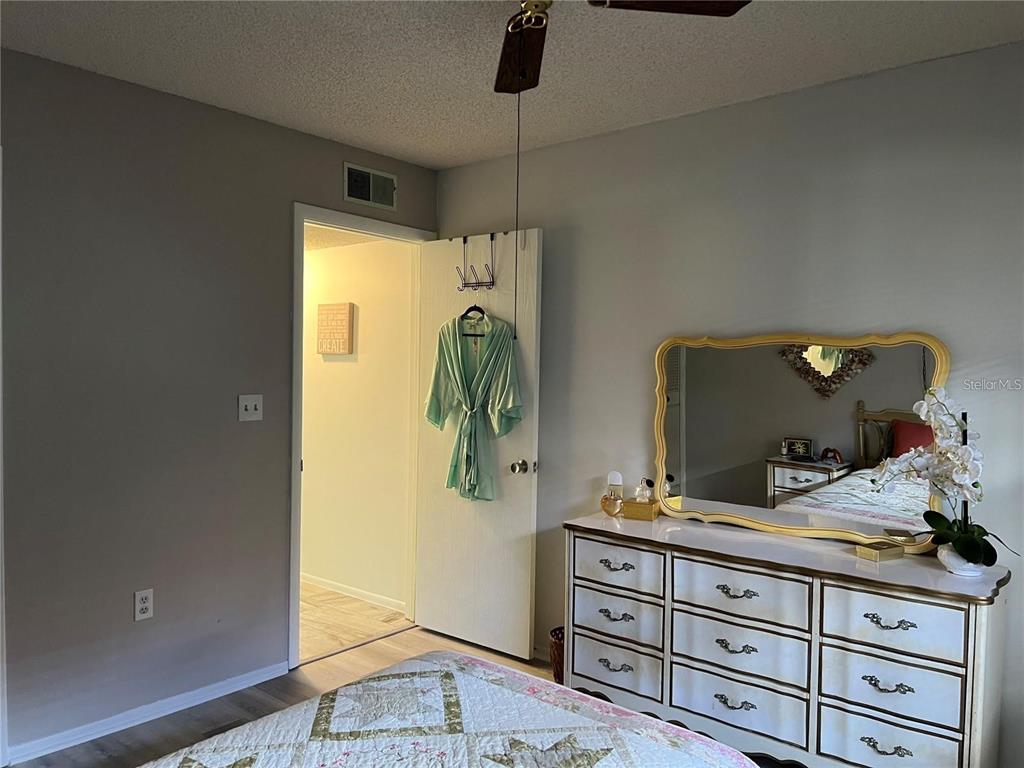 1100 East Bay Drive, Unit 35 Largo, FL 33770 - Photo 11 of 34 a bathroom with a granite countertop sink and a mirror