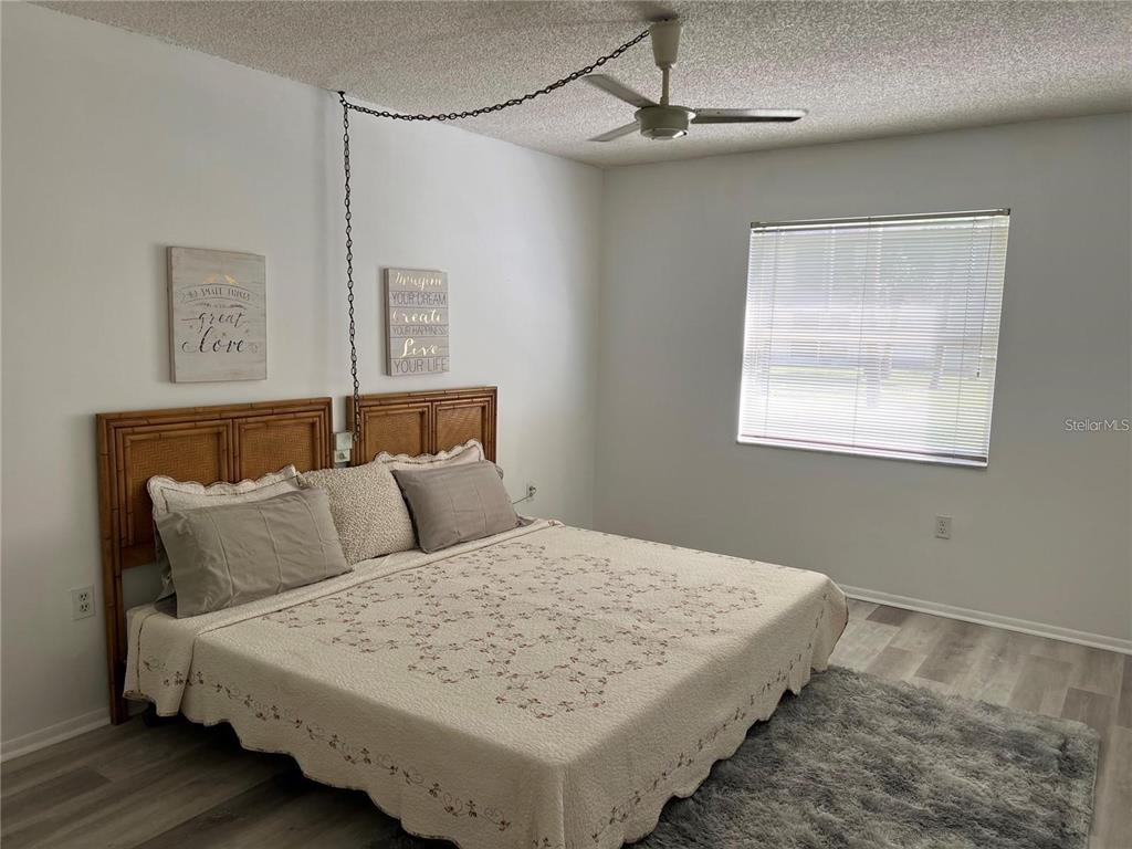 1100 East Bay Drive, Unit 35 Largo, FL 33770 - Photo 14 of 34 a bedroom with a bed and a window