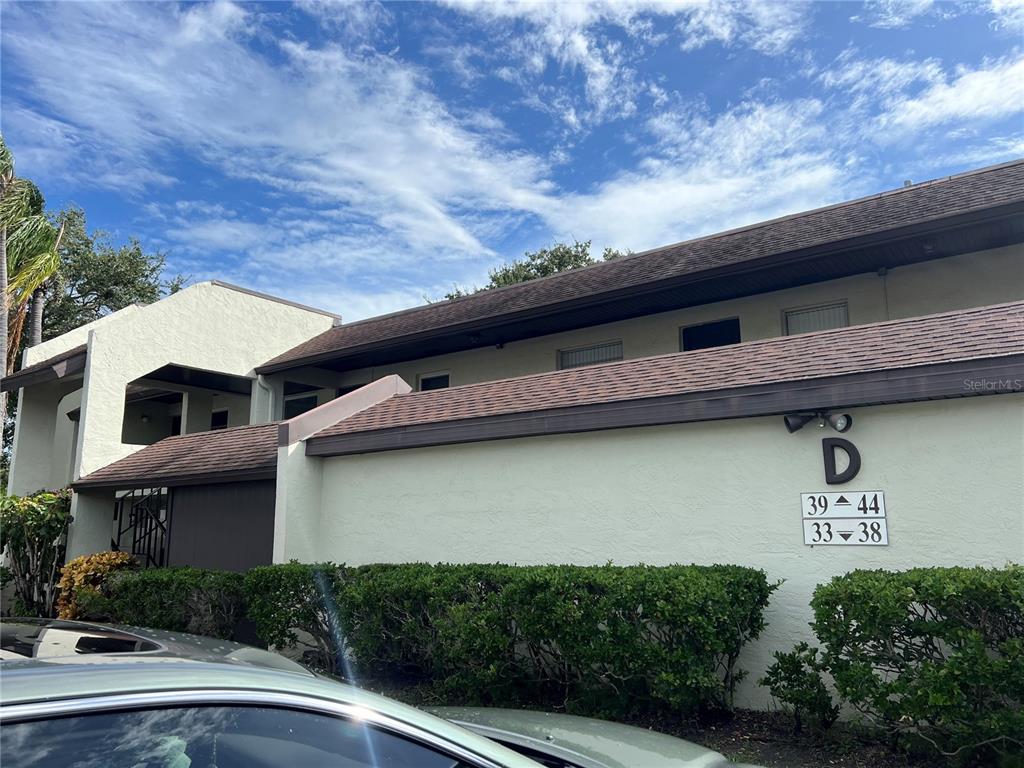 1100 East Bay Drive, Unit 35 Largo, FL 33770 - Photo 3 of 34 a view of a building with a lot of plants