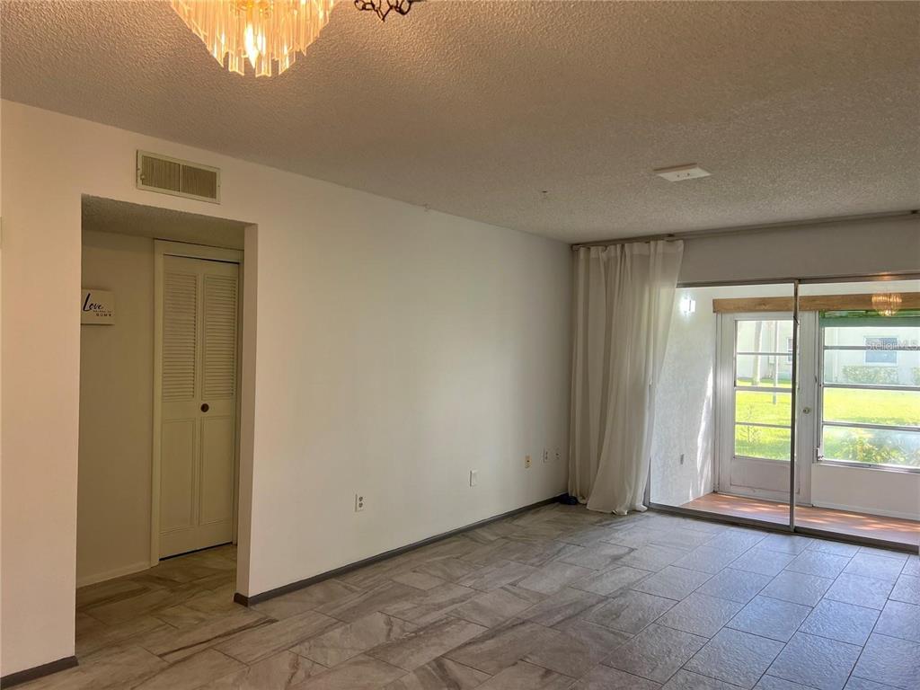 1100 East Bay Drive, Unit 35 Largo, FL 33770 - Photo 6 of 34 a view of an empty room and window