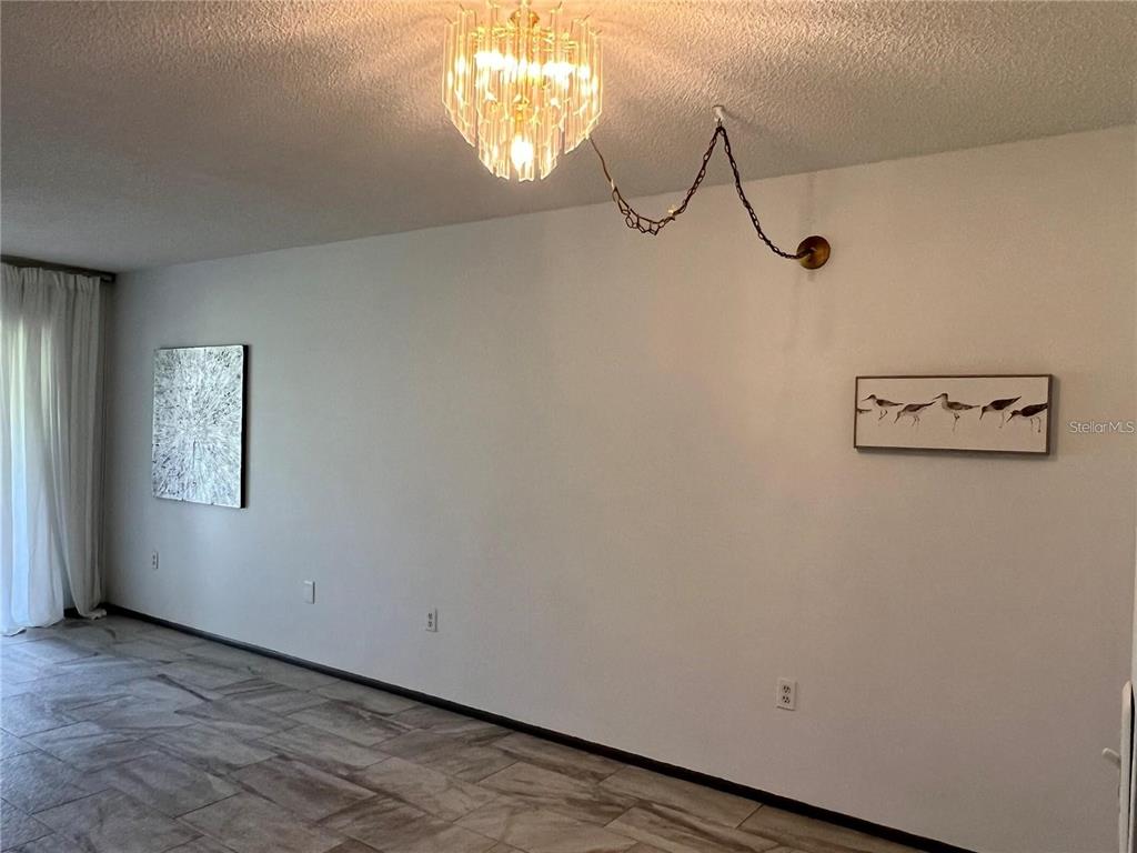 1100 East Bay Drive, Unit 35 Largo, FL 33770 - Photo 8 of 34 a view of a room with racks on the wall