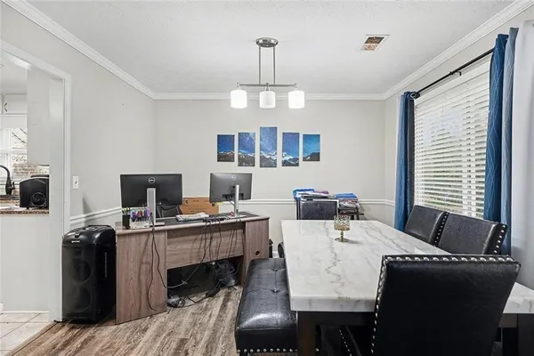a bedroom with a bed and a flat tv screen