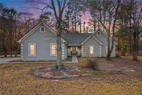 a front view of a house with a yard
