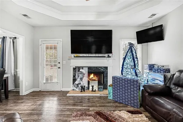 a living room with furniture and a flat screen tv