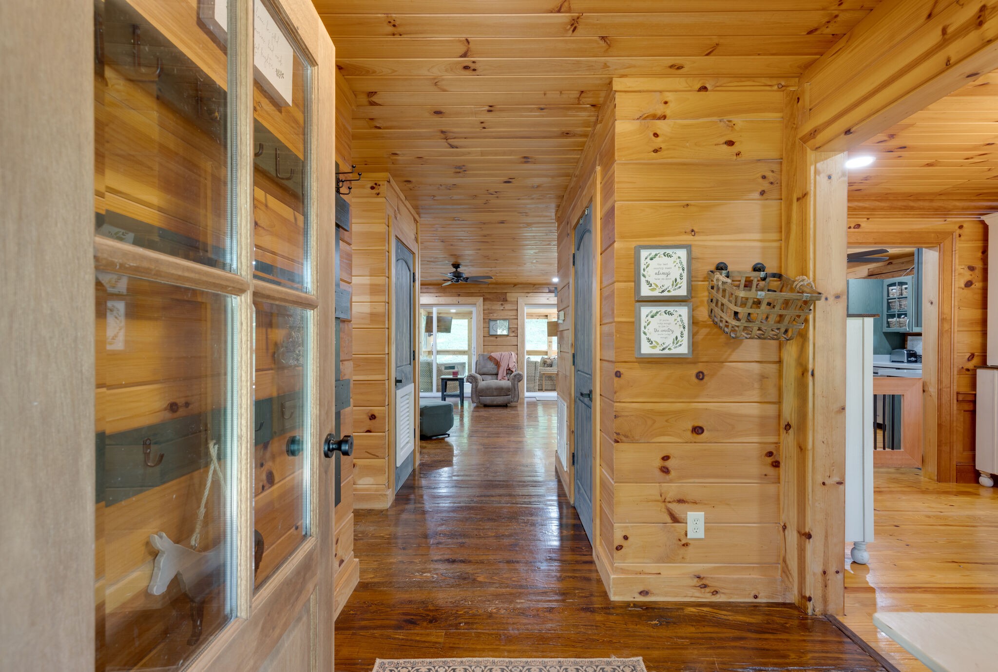 4520 Dugger Road Culleoka, TN 38451 - Photo 16 of 40 a view of a hallway with wooden floor and a living room