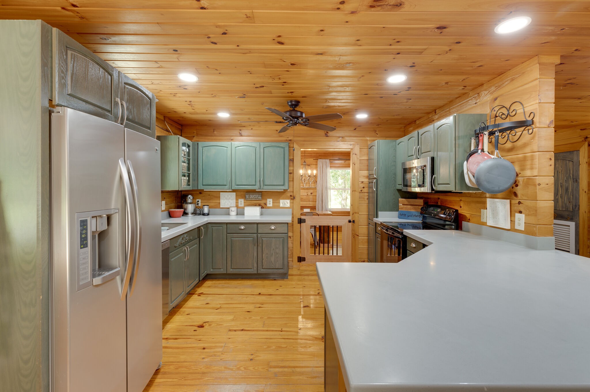 4520 Dugger Road Culleoka, TN 38451 - Photo 22 of 40 a kitchen with stainless steel appliances granite countertop a refrigerator a sink and a stove