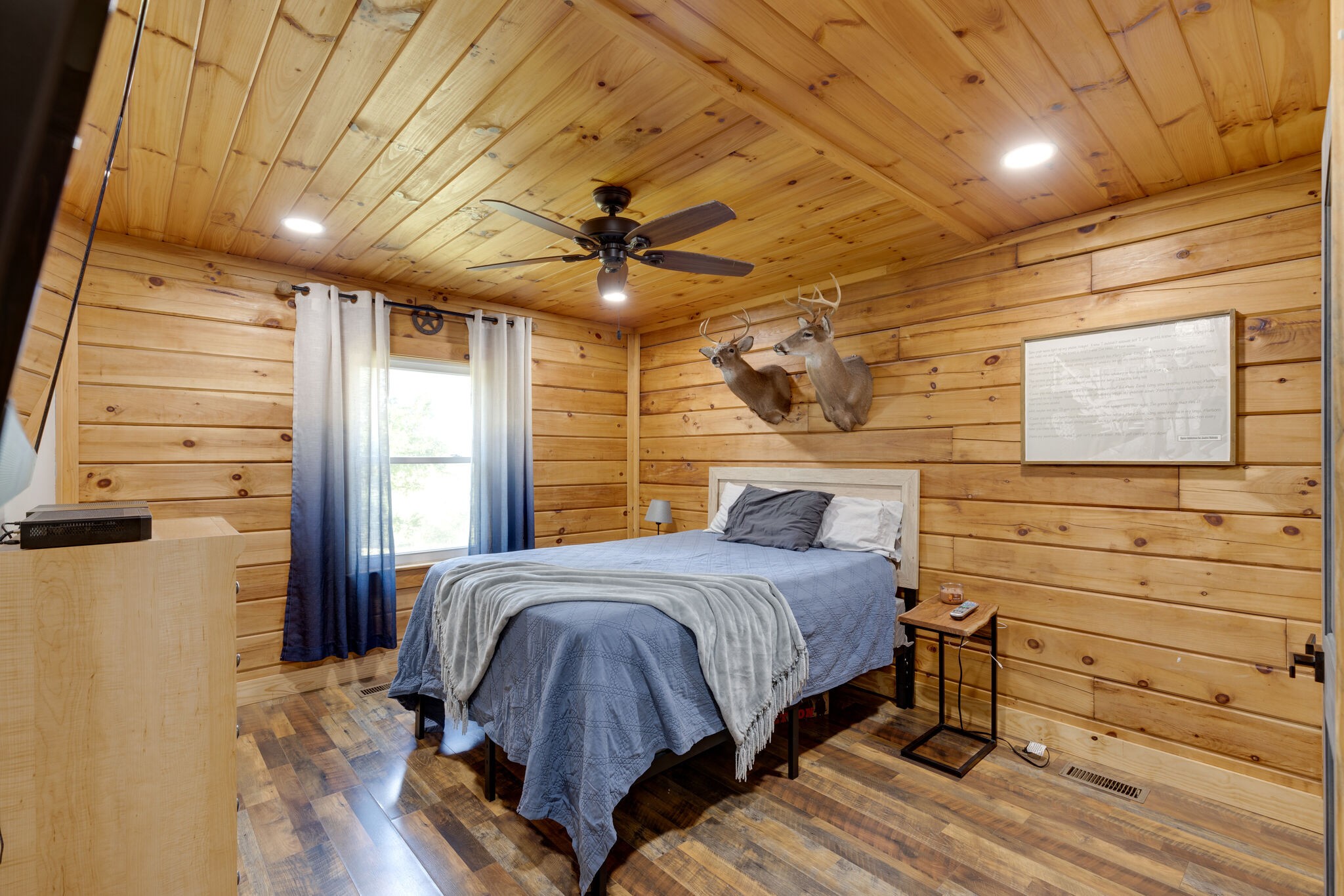 4520 Dugger Road Culleoka, TN 38451 - Photo 28 of 40 a bedroom with a bed and wooden floor