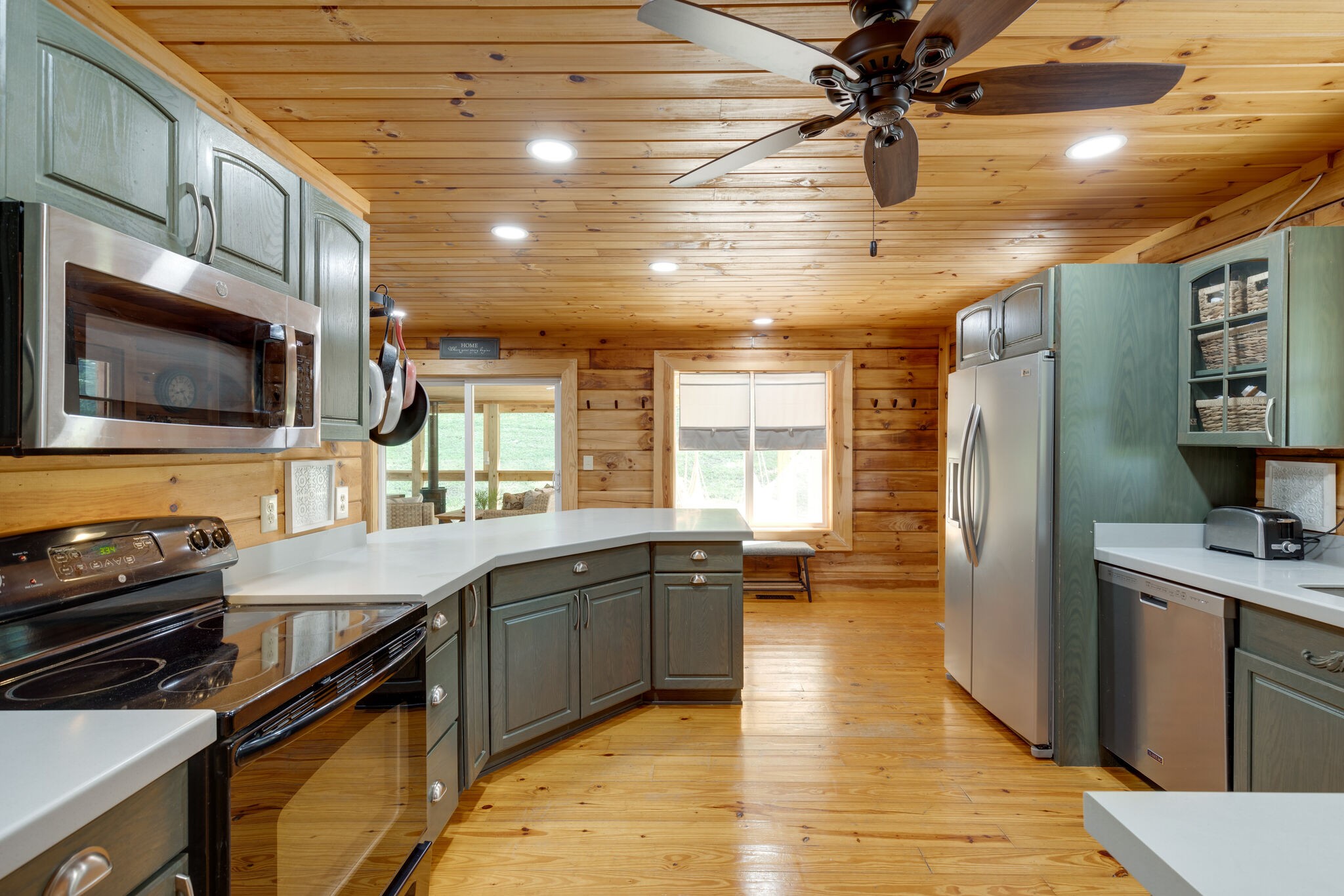 4520 Dugger Road Culleoka, TN 38451 - Photo 3 of 40 a kitchen with stainless steel appliances granite countertop a sink a stove and a wooden cabinets