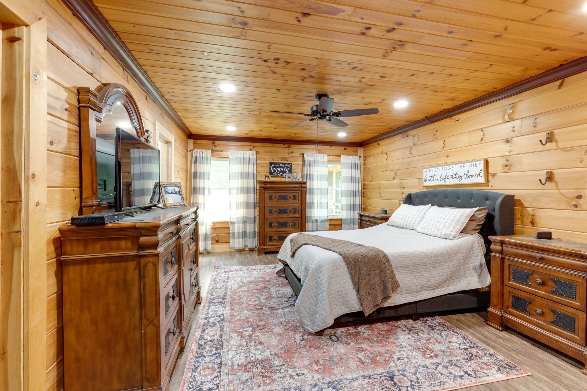 4520 Dugger Road Culleoka, TN 38451 - Photo 31 of 40 a spacious bedroom with a bed a dresser and a large window