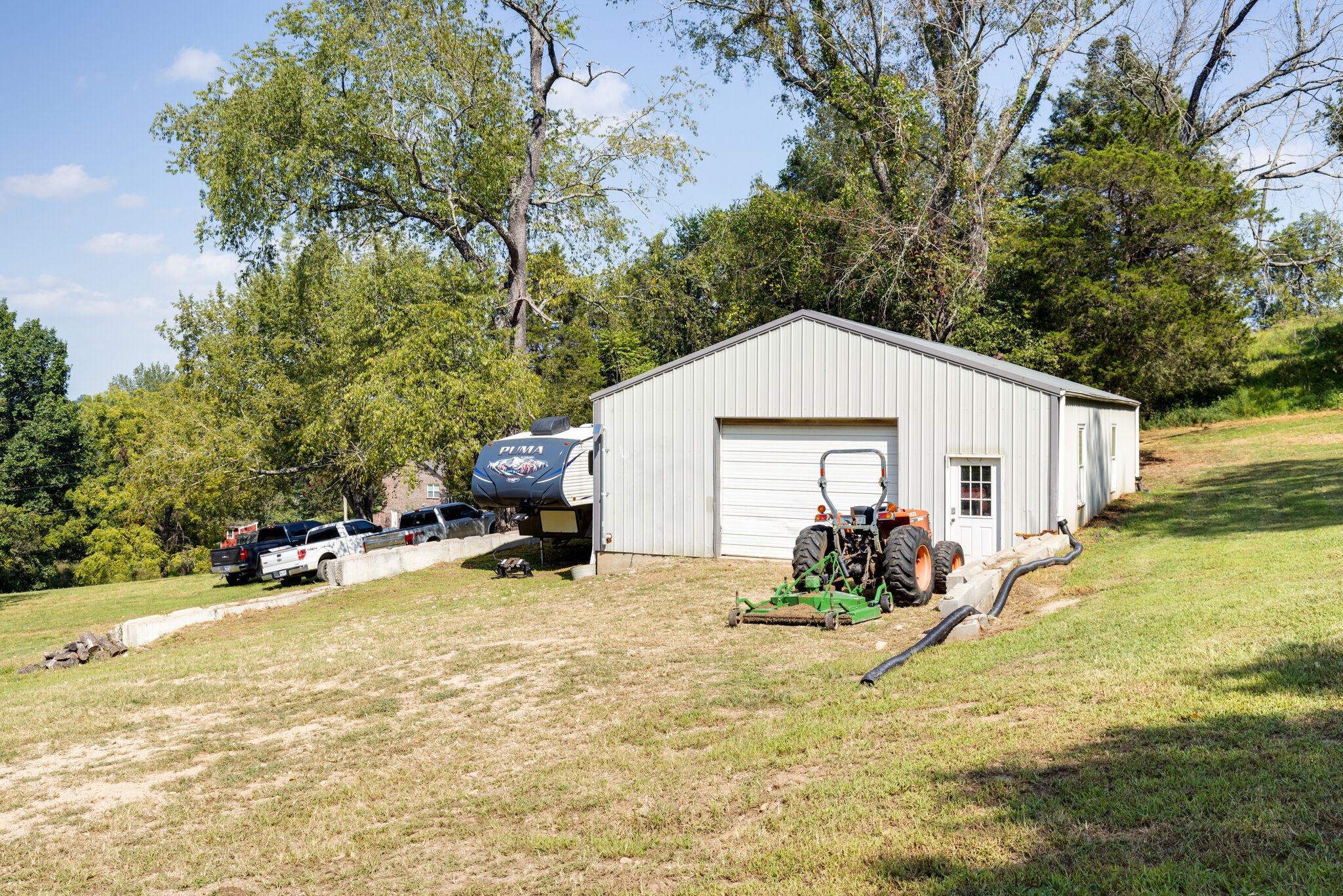 4520 Dugger Road Culleoka, TN 38451 - Photo 39 of 40 a view of a house with backyard and sitting area