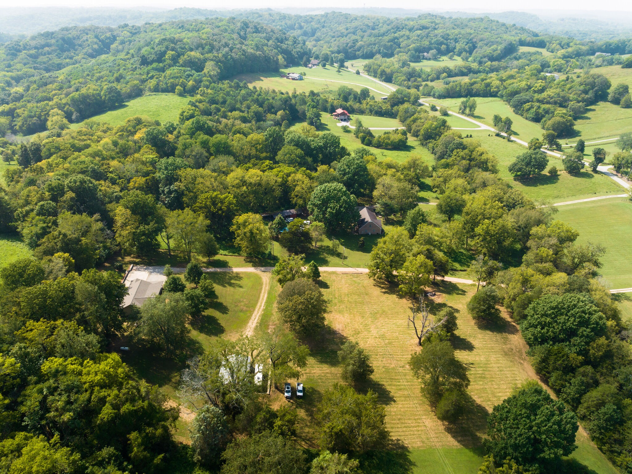 4520 Dugger Road Culleoka, TN 38451 - Photo 4 of 40 a view of a houses with a lush green forest