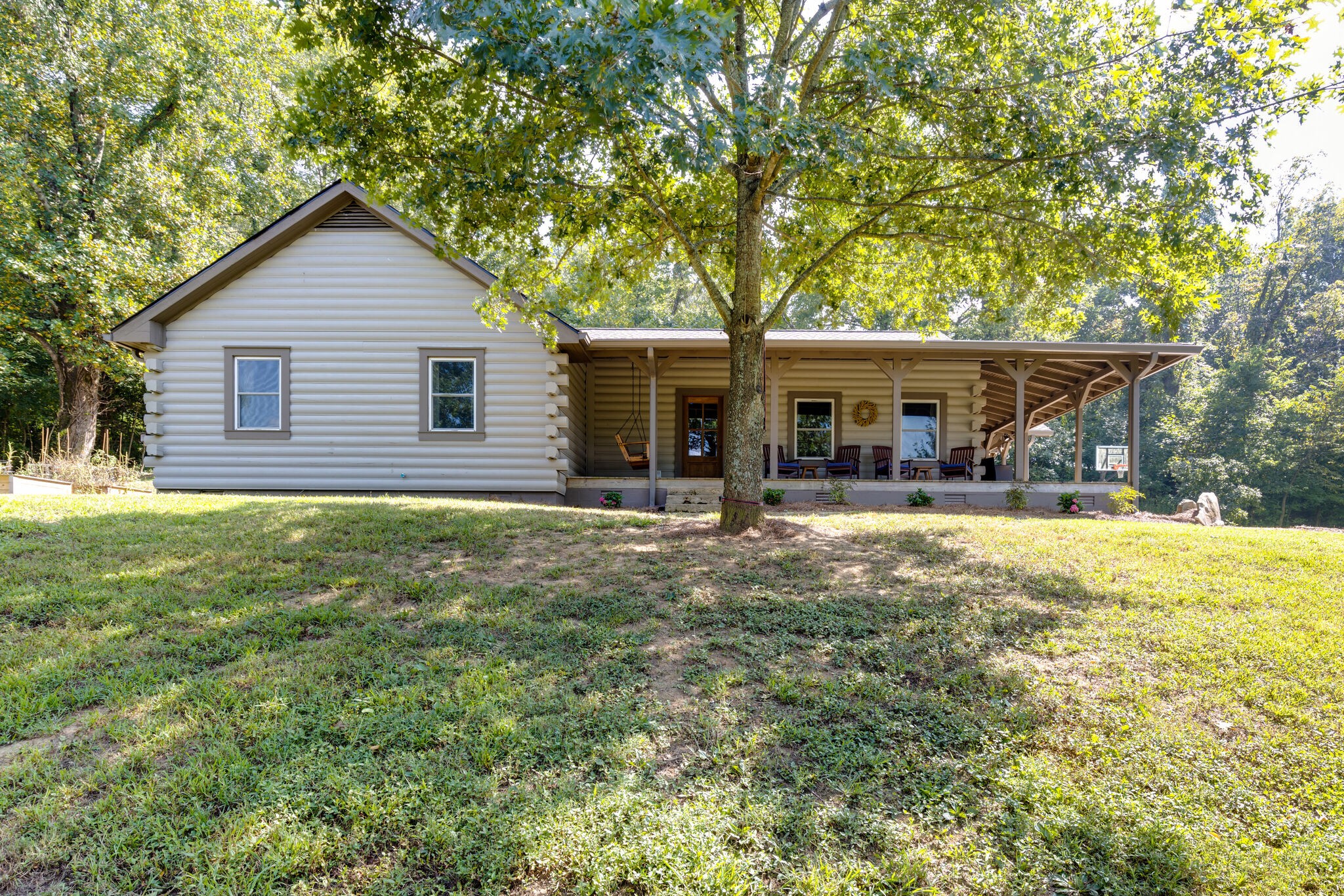 4520 Dugger Road Culleoka, TN 38451 - Photo 10 of 40 a view of a house with a yard and sitting area