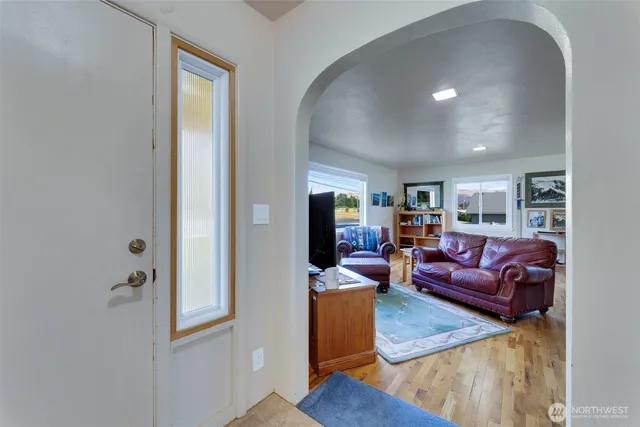 a kitchen with stainless steel appliances white cabinets and a stove top oven