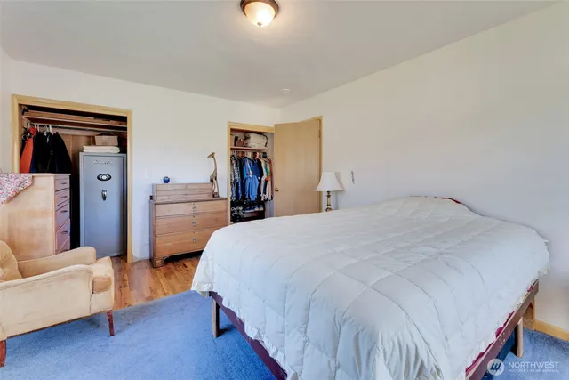 a bedroom with a bed and a view of bedroom