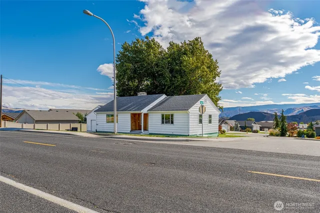 a view of house with outdoor space and a street view