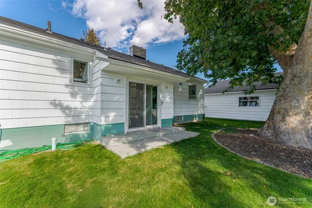 a view of a garden with an outdoor seating