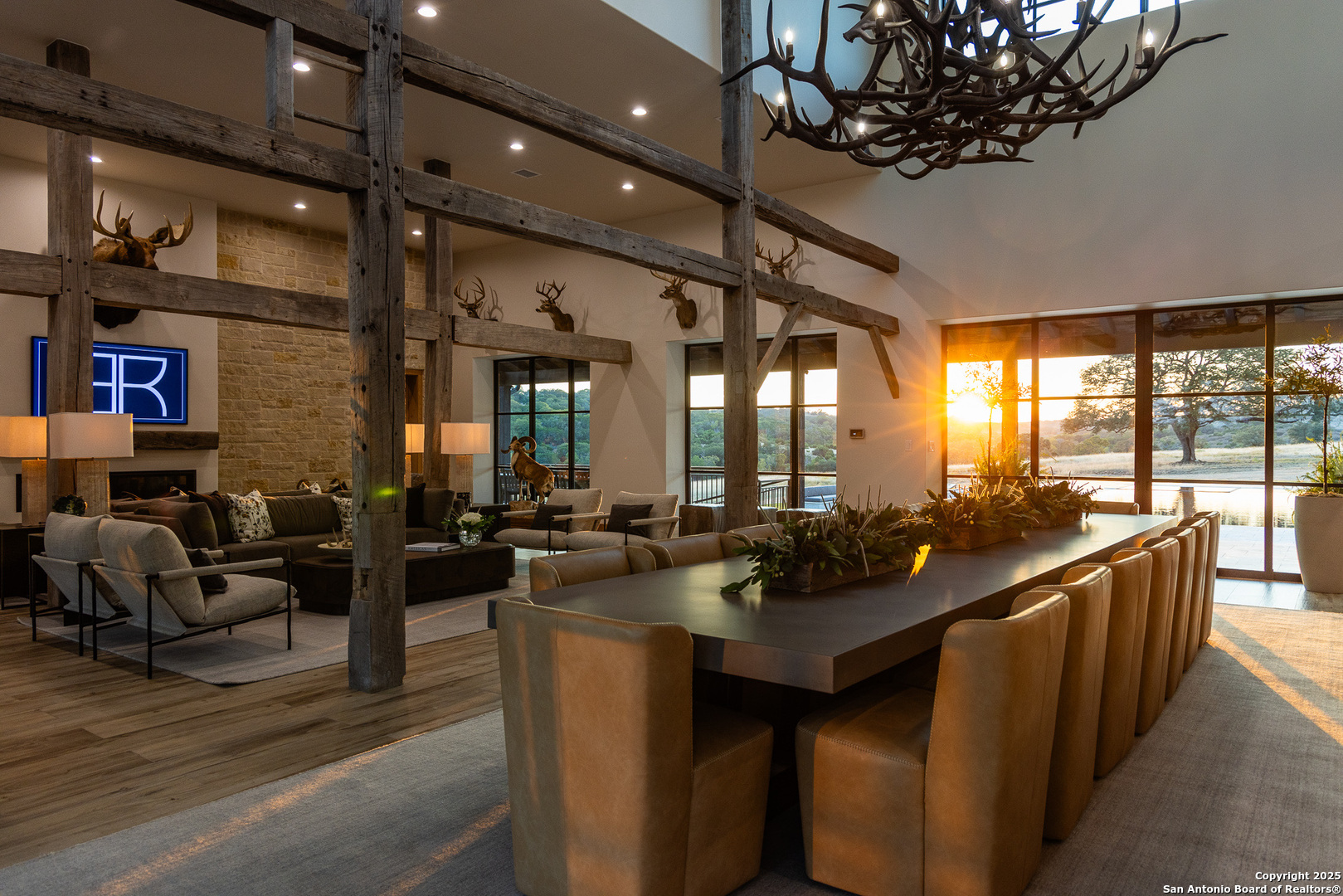 3280 Highway 39 Hunt, TX 78024 - Photo 13 of 50 a view of a dining room with furniture a chandelier and large windows
