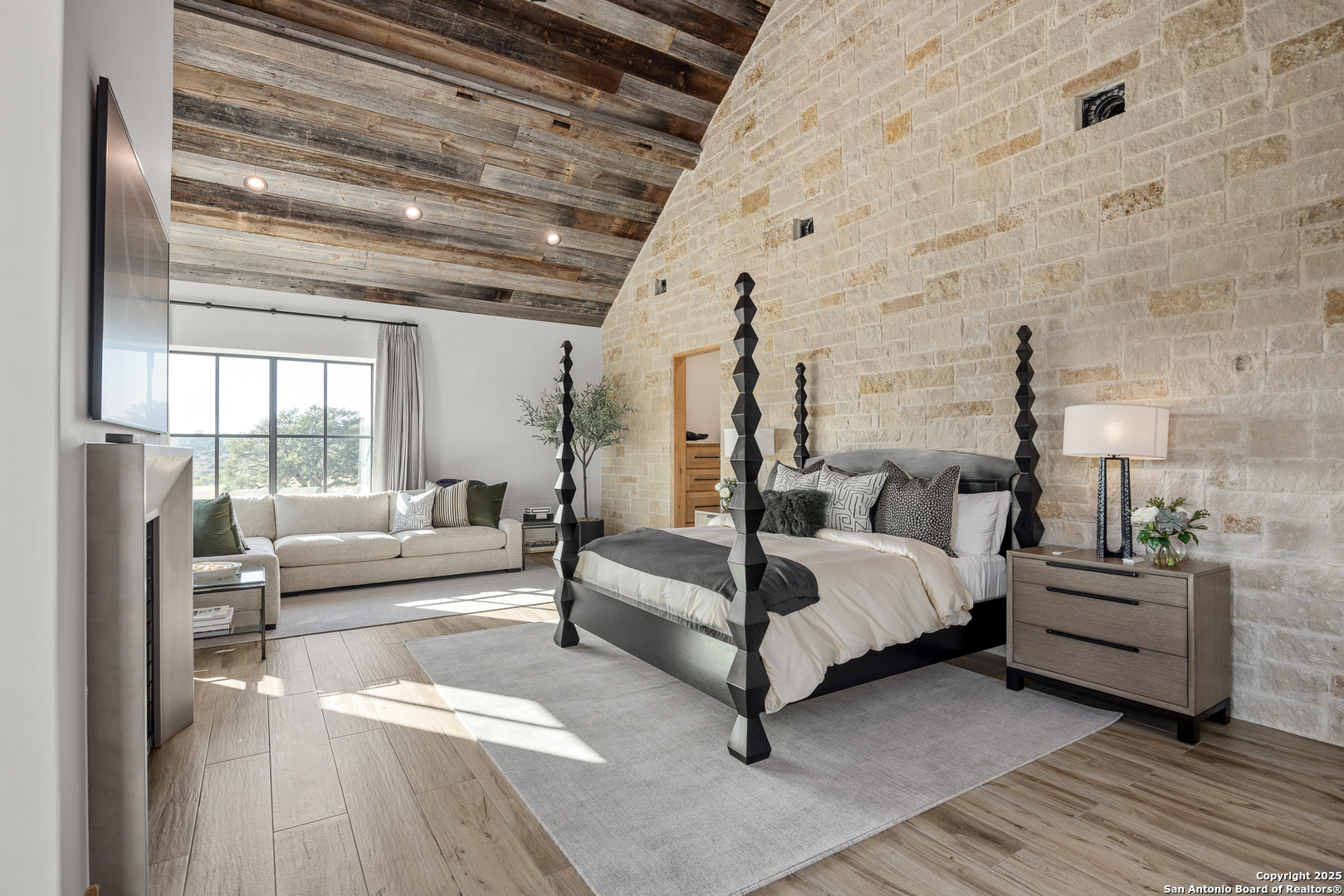 3280 Highway 39 Hunt, TX 78024 - Photo 32 of 50 a spacious bedroom with a bed and large windows