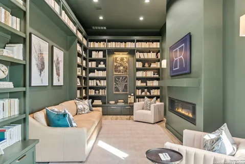 a view of living room with furniture and a chandelier