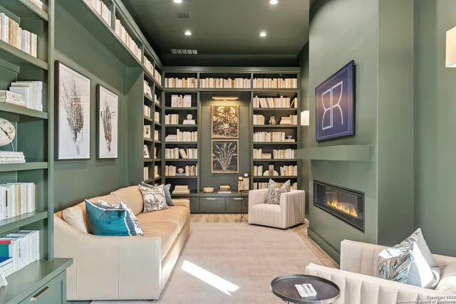 a view of living room with furniture and a chandelier