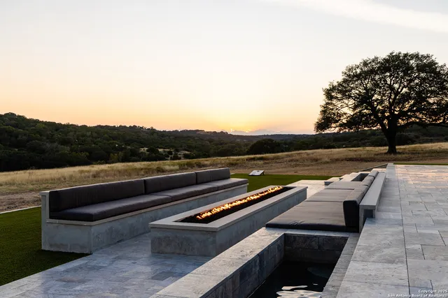 a front view of a large building with swimming pool