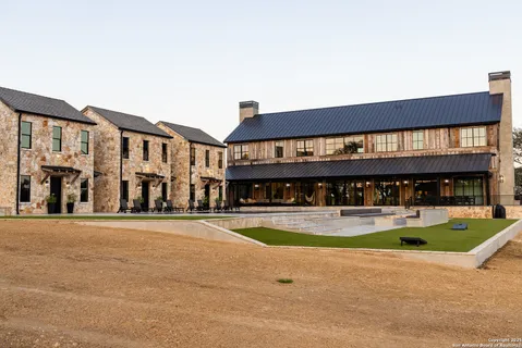 a view of swimming pool with seating space